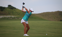 Female golfer in her backswing